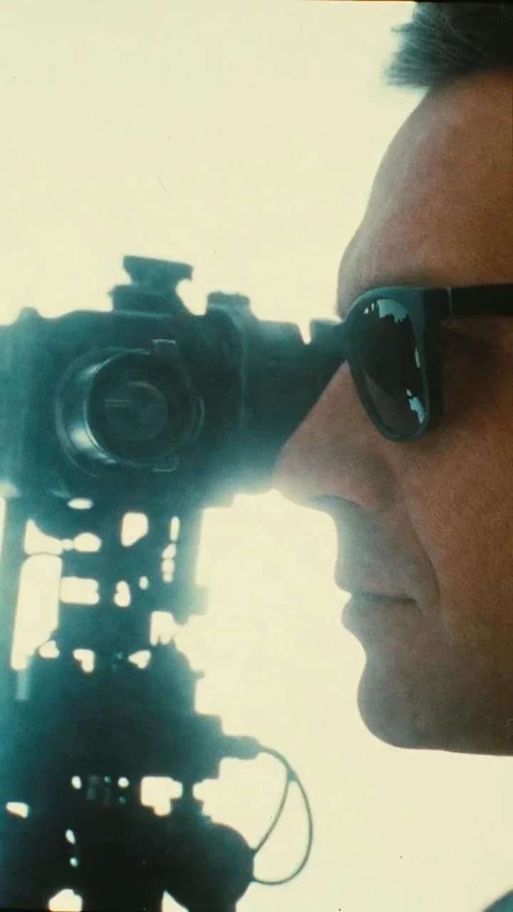 Camera operator framed by warm backlight
